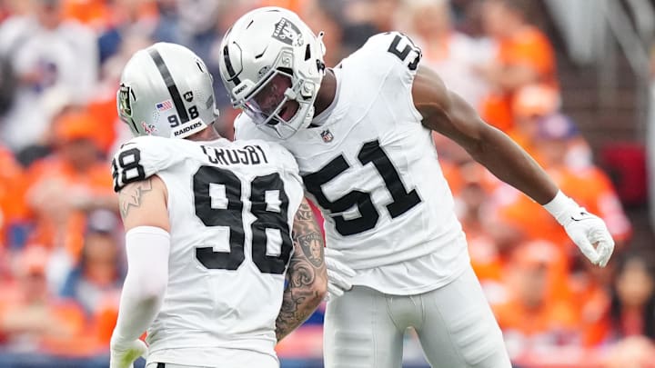 Sep 10, 2023; Denver, Colorado, USA; Las Vegas Raiders defensive end Malcolm Koonce (51) celebrates a sack with defensive end Maxx Crosby (98) against the Denver Broncos in the second quarter at Empower Field at Mile High. Mandatory Credit: Ron Chenoy-Imagn Images