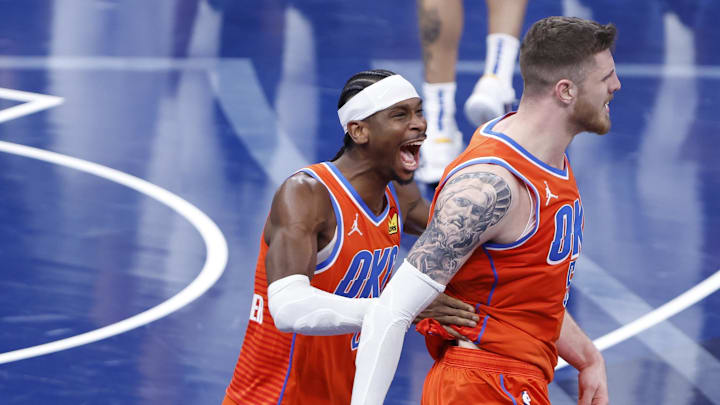 Dec 10, 2024; Oklahoma City, Oklahoma, USA; Oklahoma City Thunder guard Shai Gilgeous-Alexander (2) celebrates with center Isaiah Hartenstein (55) after Isaiah dunks against the Dallas Mavericks during the third quarter at Paycom Center. Mandatory Credit: Alonzo Adams-Imagn Images