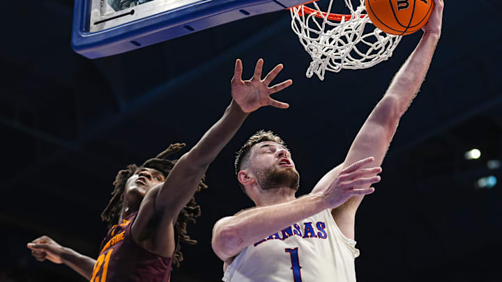 Jan 8, 2025; Lawrence, Kansas, USA; Kansas Jayhawks center Hunter Dickinson (1) shoots against Arizona State Sun Devils forward Jayden Quaintance (21) during the second half at Allen Fieldhouse. Mandatory Credit: Jay Biggerstaff-Imagn Images