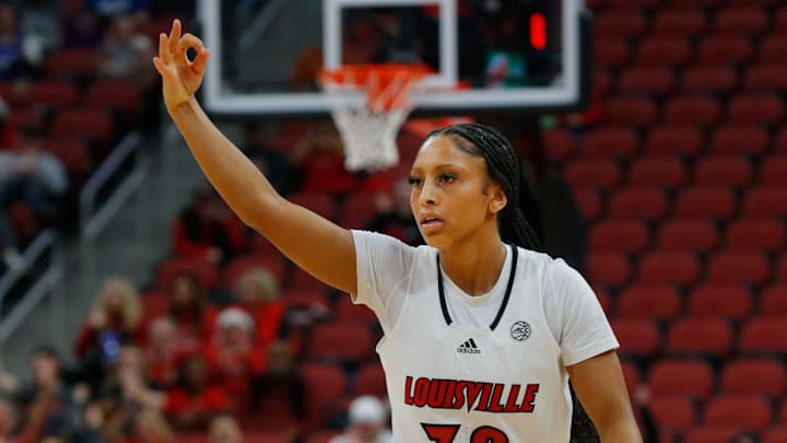 Louisville's Jayda Curry celebrates making a three against Washington in the KFC Yum Center. Louisville's Jayda Curry celebrates making a three against Washington in the KFC Yum Center.