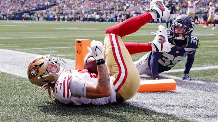 Sep 7, 2025; Seattle, Washington, USA; San Francisco 49ers tight end George Kittle (85) celebrates after scoring a touchdown during the first half against the Seattle Seahawks during the first quarter at Lumen Field. Mandatory Credit: Joe Nicholson-Imagn Images