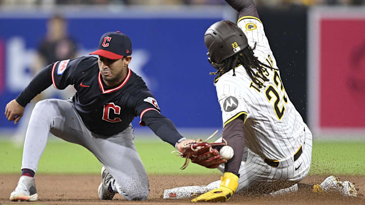 Apr 1, 2025; San Diego, California, USA; San Diego Padres right fielder Fernando Tatis Jr. (23) steals second base ahead of the tag of Cleveland Guardians shortstop Brayan Rocchio (4) during the seventh inning at Petco Park. Mandatory Credit: Denis Poroy-Imagn Images Apr 1, 2025; San Diego, California, USA; San Diego Padres right fielder Fernando Tatis Jr. (23) steals second base ahead of the tag of Cleveland Guardians shortstop Brayan Rocchio (4) during the seventh inning at Petco Park. Mandatory Credit: Denis Poroy-Imagn Images
