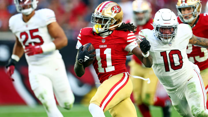 Dec 17, 2023; Glendale, Arizona, USA; San Francisco 49ers wide receiver Brandon Aiyuk (11) runs the ball against San Francisco 49ers wide receiver Ronnie Bell (10) during the second half at State Farm Stadium. Dec 17, 2023; Glendale, Arizona, USA; San Francisco 49ers wide receiver Brandon Aiyuk (11) runs the ball against San Francisco 49ers wide receiver Ronnie Bell (10) during the second half at State Farm Stadium.