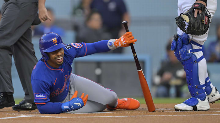 Jun 4, 2025; Los Angeles, California, USA; New York Mets shortstop Francisco Lindor (12) reacts to getting hit by a pitch first inning against the Los Angeles Dodgers at Dodger Stadium. Mandatory Credit: Jayne Kamin-Oncea-Imagn Images