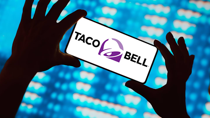 In this photo illustration, the Taco Bell logo is displayed...