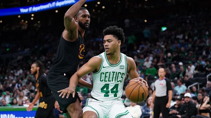 May 9, 2024; Boston, Massachusetts, USA; Boston Celtics guard Jaden Springer (44) drives the ball against Cleveland Cavaliers forward Evan Mobley (4) in the second half during game two of the second round for the 2024 NBA playoffs at TD Garden. Mandatory Credit: David Butler II-Imagn Images