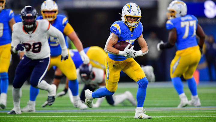 Dec 19, 2024; Inglewood, California, USA; Los Angeles Chargers wide receiver Ladd McConkey (15) runs the ball against the Denver Broncos during the second half at SoFi Stadium. 