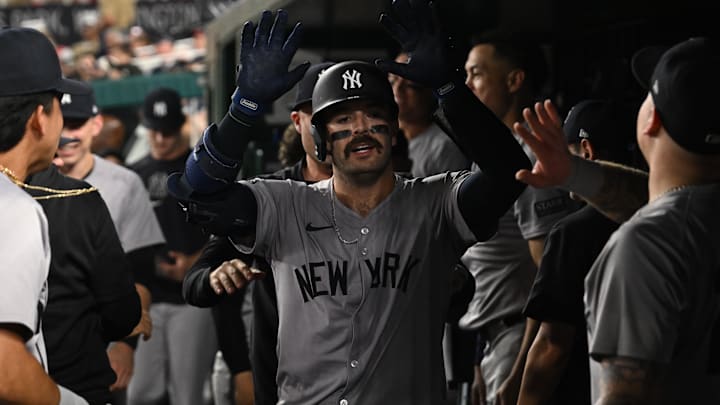 Aug 26, 2024; Washington, District of Columbia, USA; New York Yankees catcher Austin Wells (28) celebrates in the dugout after hitting a home run against the Washington Nationals during the sixth inning at Nationals Park. Mandatory Credit: Rafael Suanes-Imagn Images