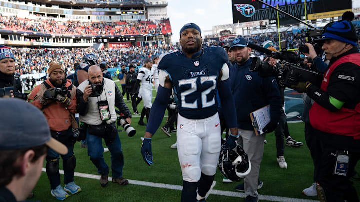 Tennessee Titans running back Derrick Henry (22) heads off the field after possibly his last game as