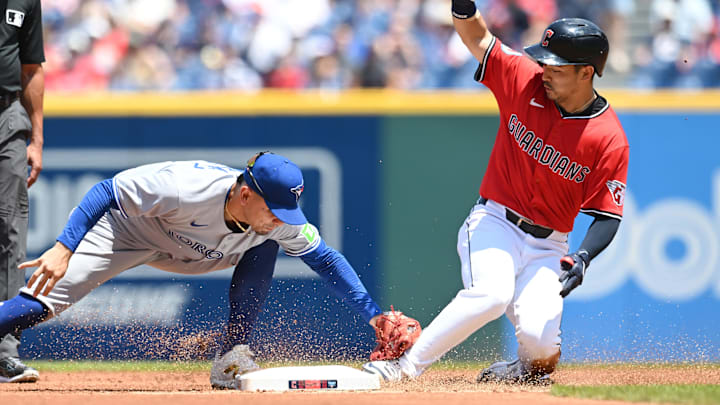 Jun 26, 2025; Cleveland, Ohio, USA; Cleveland Guardians left fielder Steven Kwan (38) slides into second with a double as Toronto Blue Jays second baseman Andres Gimenez (0) is late with the tag during the first inning at Progressive Field. Mandatory Credit: Ken Blaze-Imagn Images Jun 26, 2025; Cleveland, Ohio, USA; Cleveland Guardians left fielder Steven Kwan (38) slides into second with a double as Toronto Blue Jays second baseman Andres Gimenez (0) is late with the tag during the first inning at Progressive Field. Mandatory Credit: Ken Blaze-Imagn Images