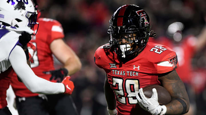 Texas Tech's running back Tahj Brooks (28) runs for a touchdown against TCU in a Big 12 football