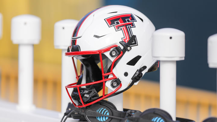 A Texas Tech Red Raiders helmet sits along the bench area during pregame between the West Virginia Mountaineers and the Texas Tech Red Raiders at Milan Puskar Stadium. 