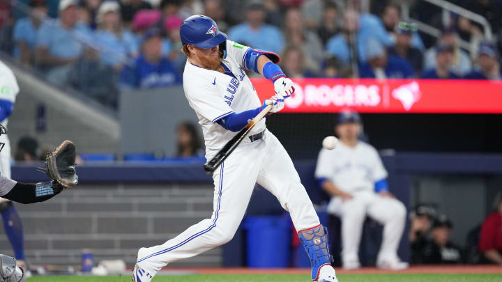 Jun 30, 2024; Toronto, Ontario, CAN; Toronto Blue Jays designated hitter Justin Turner (2) hits a single against the New York Yankees during the third inning at Rogers Centre. Mandatory Credit: Nick Turchiaro-USA TODAY Sports Jun 30, 2024; Toronto, Ontario, CAN; Toronto Blue Jays designated hitter Justin Turner (2) hits a single against the New York Yankees during the third inning at Rogers Centre. Mandatory Credit: Nick Turchiaro-USA TODAY Sports