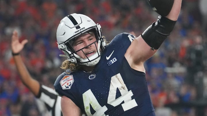 Dec 31, 2024; Glendale, AZ, US; Penn State Nittany Lions tight end Tyler Warren (44) celebrates his touchdown catch against the Boise State Broncos in their Vrbo Fiesta Bowl matchup at State Farm Stadium.
