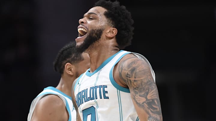 Jan 7, 2025; Charlotte, North Carolina, USA;  Charlotte Hornets forward Miles Bridges (0) celebrates after scoring during the second half against the Phoenix Suns at the Spectrum Center. Mandatory Credit: Sam Sharpe-Imagn Images