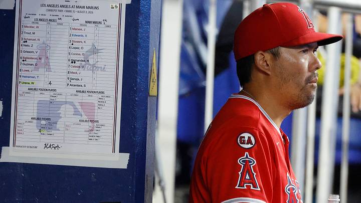 Aug 8, 2026; Miami, Florida, USA;  Los Angeles Angels manager Kurt Suzuki (8) stands in the dugout against the Miami Marlins during the fourth inning at loanDepot Park. Mandatory Credit: Rhona Wise-Imagn Images