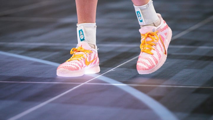 Mar 8, 2026; Kansas City, MO, USA; Player shoes glow on the new digital floor during the game between the West Virginia Mountaineers and the TCU Horned Frogs at T-Mobile Center.