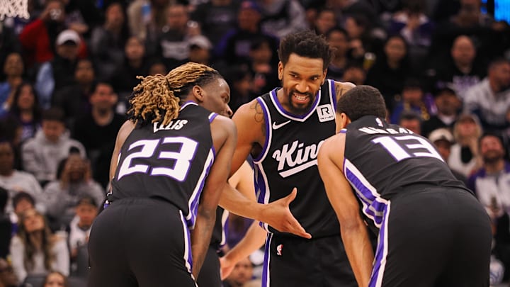 Feb 8, 2025; Sacramento, California, USA; Sacramento Kings guard Malik Monk (0) speaks with teammates guard Keon Ellis (23) and forward Keegan Murray (13) between plays against the New Orleans Pelicans during the third quarter at Golden 1 Center. Mandatory Credit: Kelley L Cox-Imagn Images Feb 8, 2025; Sacramento, California, USA; Sacramento Kings guard Malik Monk (0) speaks with teammates guard Keon Ellis (23) and forward Keegan Murray (13) between plays against the New Orleans Pelicans during the third quarter at Golden 1 Center. Mandatory Credit: Kelley L Cox-Imagn Images