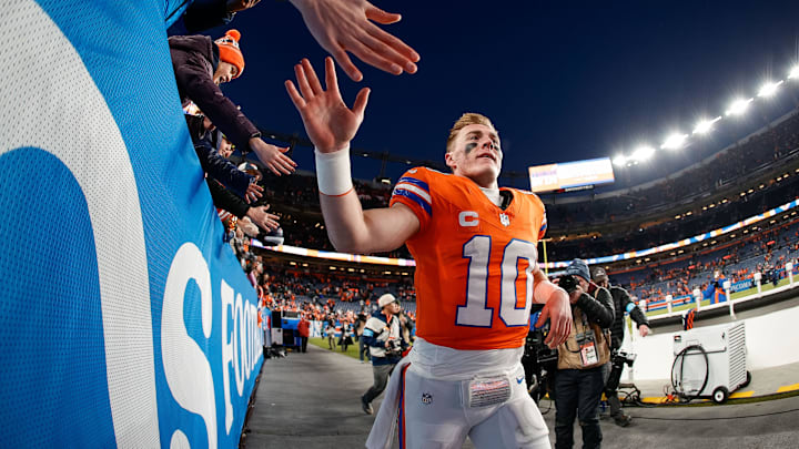 Denver Broncos quarterback Bo Nix (10) celebrates with fans after the game against the Kansas City Chiefs at Empower Field at Mile High.
