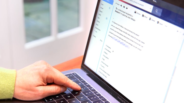 Photo Illustration Spam 'Phishing' email on Laptop