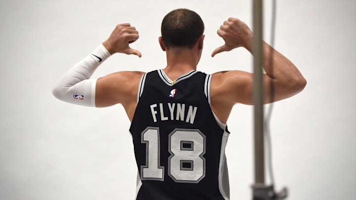 Sep 30, 2024; San Antonio, Texas, USA; Then-San Antonio Spurs guard Malachi Flynn (18, now 22) poses for a photo during the team's Media Day at Victory Capital Performance Center. Flynn will join the Austin Spurs for training camp after being waived.