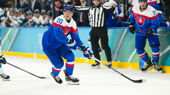 Feb 21, 2026; Milan, Italy; Juraj Slafkovsky (20) of Slovakia moves the puck in the second period against Finland in the men's ice hockey bronze medal game during the Milano Cortina 2026 Olympic Winter Games at Milano Santagiulia Ice Hockey Arena. Mandatory Credit: Joe Camporeale-Imagn Images
