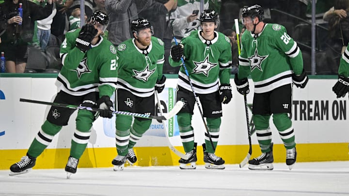 Feb 13, 2024; Dallas, Texas, USA; Dallas Stars defenseman Ryan Suter (20) and center Roope Hintz