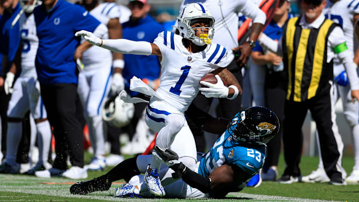 Jacksonville Jaguars linebacker Foyesade Oluokun (23) tackles Indianapolis Colts wide receiver Josh Downs (1) out of bounds during the second quarter of an NFL football matchup Sunday, Oct. 15, 2023 at EverBank Stadium in Jacksonville, Fla. The Jacksonville Jaguars defeated the Indianapolis Colts 37-20. [Corey Perrine/Florida Times-Union]