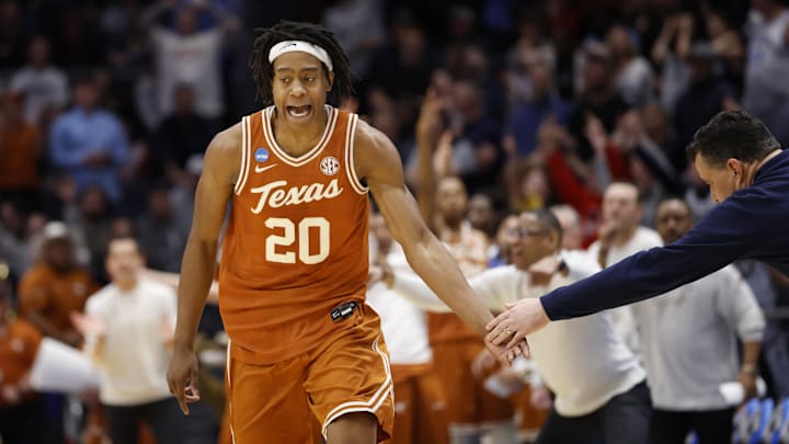 Mar 19, 2025; Dayton, OH, USA; Texas Longhorns guard Tre Johnson (20) high fives Xavier Musketeers head coach Sean Miller after making a three point basket in the second half at UD Arena. Mandatory Credit: Rick Osentoski-Imagn Images Mar 19, 2025; Dayton, OH, USA; Texas Longhorns guard Tre Johnson (20) high fives Xavier Musketeers head coach Sean Miller after making a three point basket in the second half at UD Arena. Mandatory Credit: Rick Osentoski-Imagn Images