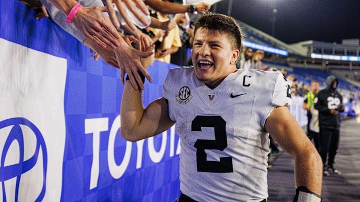 Oct 12, 2024; Lexington, Kentucky, USA; Vanderbilt Commodores quarterback Diego Pavia (2) high fives fans in the stands after a game against the Kentucky Wildcats at Kroger Field. Mandatory Credit: Jordan Prather-Imagn Images