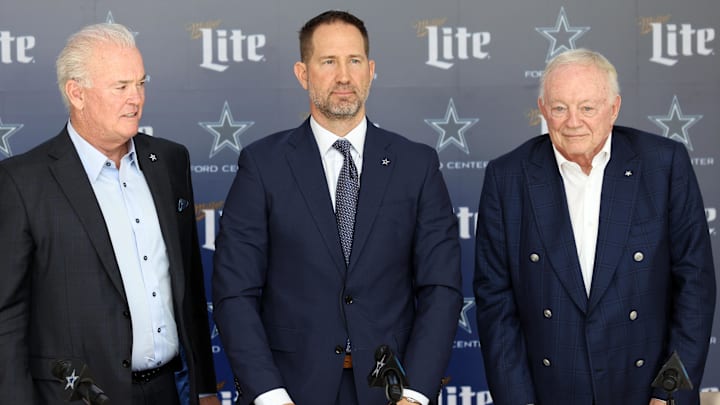 Dallas Cowboys CEO Stephen Jones, head coach Brian Schottenheimer and owner Jerry Jones pose for pictures after a press conference at the Star.