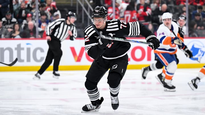 New Jersey Devils center Nick Bjugstad (72) chases the puck against the New York Islanders during the second period at Prudential Center. Mandatory Credit: John Jones-Imagn Images