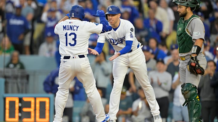 May 15, 2025; Los Angeles, California, USA; Los Angeles Dodgers first baseman Freddie Freeman (5) congratulates teammate third baseman Max Muncy (13) after they scored a two-run home run by Muncy against the Athletics during the first inning of the game at Dodger Stadium. Mandatory Credit: Jayne Kamin-Oncea-Imagn Images May 15, 2025; Los Angeles, California, USA; Los Angeles Dodgers first baseman Freddie Freeman (5) congratulates teammate third baseman Max Muncy (13) after they scored a two-run home run by Muncy against the Athletics during the first inning of the game at Dodger Stadium. Mandatory Credit: Jayne Kamin-Oncea-Imagn Images