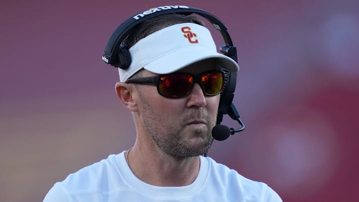Oct 21, 2023; Los Angeles, California, USA; Southern California Trojans head coach Lincoln Riley watches from the sidelines against the Utah Utes in the first half at United Airlines Field at Los Angeles Memorial Coliseum. Mandatory Credit: Kirby Lee-Imagn Images