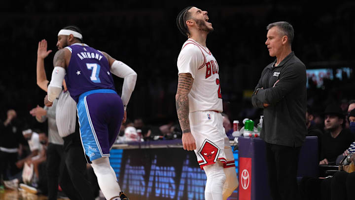 Chicago Bulls guard Lonzo Ball (2) celebrates after a 3-point basket as coach Billy Donovan (right) and Los Angeles Lakers forward Carmelo Anthony (7) watch in the second half at Staples Center. The Bulls defeated the Lakers 121-103.  Mandatory Credit: Kirby Lee-Imagn Images