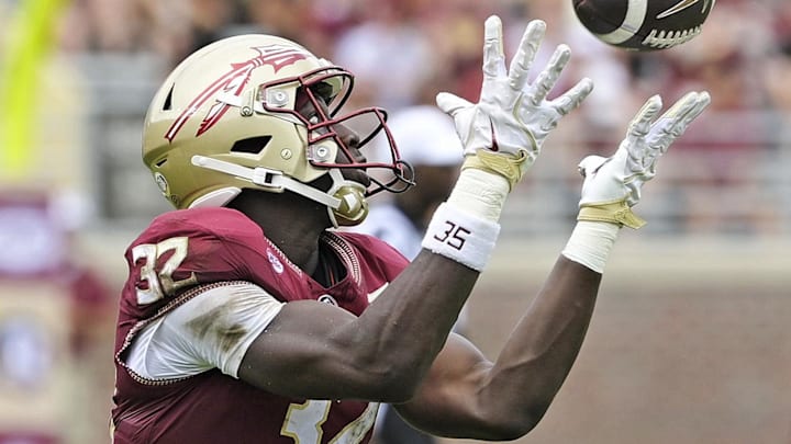 Sep 6, 2025; Tallahassee, Florida, USA; Florida State Seminoles running back Ousmane Kromah (32) catches a touchdown pass during the second half of the game against the East Texas A&M Lions at Doak S. Campbell Stadium. Mandatory Credit: Melina Myers-Imagn Images