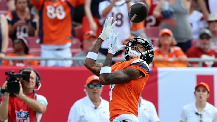 Sep 22, 2024; Tampa, Florida, USA; Denver Broncos wide receiver Josh Reynolds (11) catches the ball against the Tampa Bay Buccaneers during the first quarter at Raymond James Stadium. Mandatory Credit: Kim Klement Neitzel-Imagn Images Sep 22, 2024; Tampa, Florida, USA; Denver Broncos wide receiver Josh Reynolds (11) catches the ball against the Tampa Bay Buccaneers during the first quarter at Raymond James Stadium. Mandatory Credit: Kim Klement Neitzel-Imagn Images