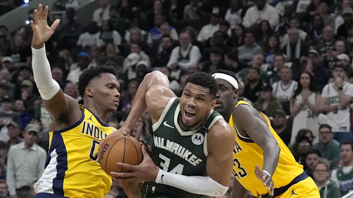 Apr 25, 2025; Milwaukee, Wisconsin, USA; Milwaukee Bucks forward Giannis Antetokounmpo (34) drives through Indiana Pacers player during game three of first round for the 2024 NBA Playoffs at Fiserv Forum. Mandatory Credit: Michael McLoone-Imagn Images