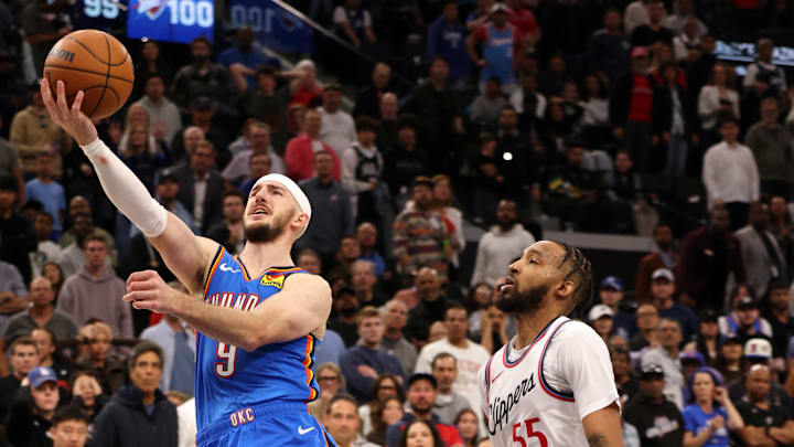 Mar 23, 2025; Inglewood, California, USA; Oklahoma City Thunder guard Alex Caruso (9) shoots against LA Clippers forward Derrick Jones Jr. (55) during the 4th quarter at Intuit Dome. Mandatory Credit: Jason Parkhurst-Imagn Images Mar 23, 2025; Inglewood, California, USA; Oklahoma City Thunder guard Alex Caruso (9) shoots against LA Clippers forward Derrick Jones Jr. (55) during the 4th quarter at Intuit Dome. Mandatory Credit: Jason Parkhurst-Imagn Images