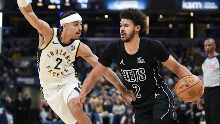 Mar 22, 2025; Indianapolis, Indiana, USA; Brooklyn Nets forward Cameron Johnson (2) goes to the basket against Indiana Pacers guard Andrew Nembhard (2) during the second half at Gainbridge Fieldhouse. Mandatory Credit: Robert Goddin-Imagn Images