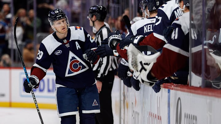 Dec 14, 2024; Denver, Colorado, USA; Colorado Avalanche center Nathan MacKinnon (29) celebrates with the bench after his goal in the third period against the Nashville Predators at Ball Arena. Mandatory Credit: Isaiah J. Downing-Imagn Images