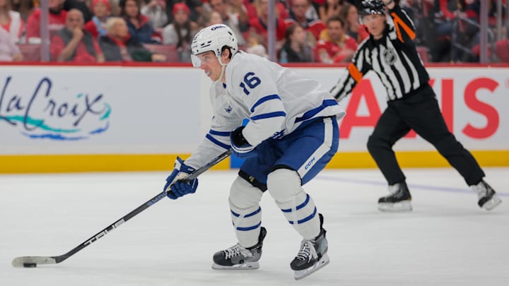 May 9, 2025; Sunrise, Florida, USA; Toronto Maple Leafs right wing Mitch Marner (16) moves the puck against the Florida Panthers during the first period in game three of the second round of the 2025 Stanley Cup Playoffs at Amerant Bank Arena. Mandatory Credit: Sam Navarro-Imagn Images
