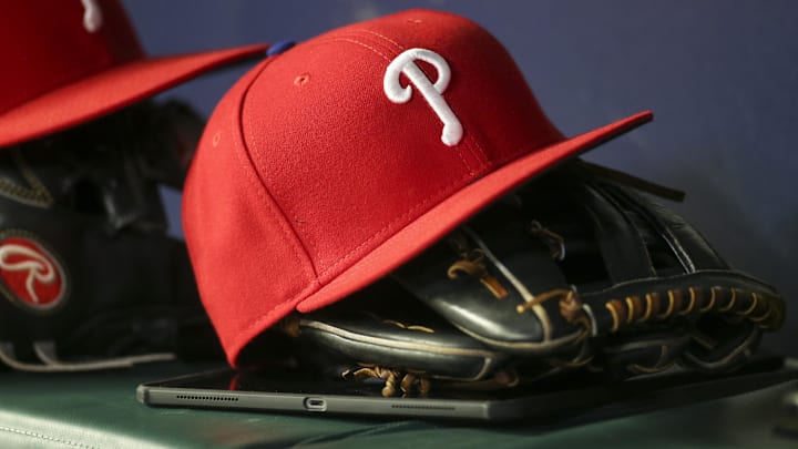 May 25, 2022; Atlanta, Georgia, USA; Detailed view of a Philadelphia Phillies hat and glove in the dugout against the Atlanta Braves in the eighth inning at Truist Park. May 25, 2022; Atlanta, Georgia, USA; Detailed view of a Philadelphia Phillies hat and glove in the dugout against the Atlanta Braves in the eighth inning at Truist Park.