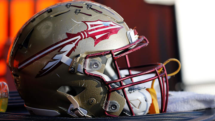 Nov 25, 2017; Gainesville, FL, USA; Florida State Seminoles helmet lays on the field against the Florida Gators during the second half at Ben Hill Griffin Stadium. Mandatory Credit: Kim Klement-Imagn Images