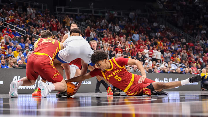 Curtis Jones dives for a loose ball as Iowa State takes on BYU at the Big 12 Conference Tournament Thursday in Kansas City.