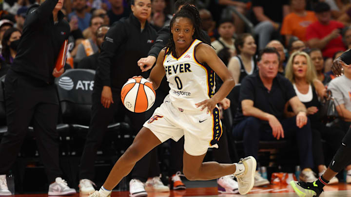 Jun 30, 2024; Phoenix, Arizona, USA; Indiana Fever guard Kelsey Mitchell (0) against the Phoenix Mercury during a WNBA game at Footprint Center. Mandatory Credit: Mark J. Rebilas-Imagn Images