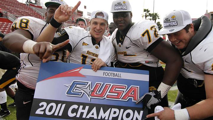 Dec 3, 2011; Houston, TX, USA; Southern Mississippi Golden Eagles offensive lineman Joe Duhon (68) and quarterback Austin Davis (12) and offensive lineman Lamar Holmes (72) celebrate a victory against the Houston Cougars at Robertson Stadium. Southern Miss defeated Houston 49-28 to win the Conference USA championship. Mandatory Credit: Brett Davis-Imagn Images Dec 3, 2011; Houston, TX, USA; Southern Mississippi Golden Eagles offensive lineman Joe Duhon (68) and quarterback Austin Davis (12) and offensive lineman Lamar Holmes (72) celebrate a victory against the Houston Cougars at Robertson Stadium. Southern Miss defeated Houston 49-28 to win the Conference USA championship. Mandatory Credit: Brett Davis-Imagn Images