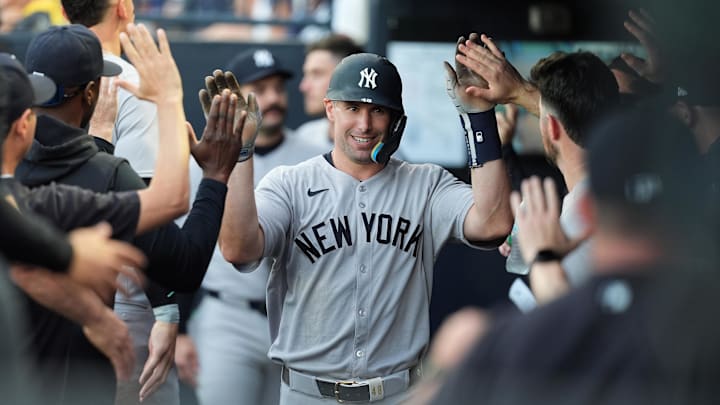 Apr 18, 2025; Tampa, Florida, USA; New York Yankees first baseman Paul Goldschmidt (48) is congratulated in the dugout after scoring during the second inning at George M. Steinbrenner Field. Mandatory Credit: Dave Nelson-Imagn Images