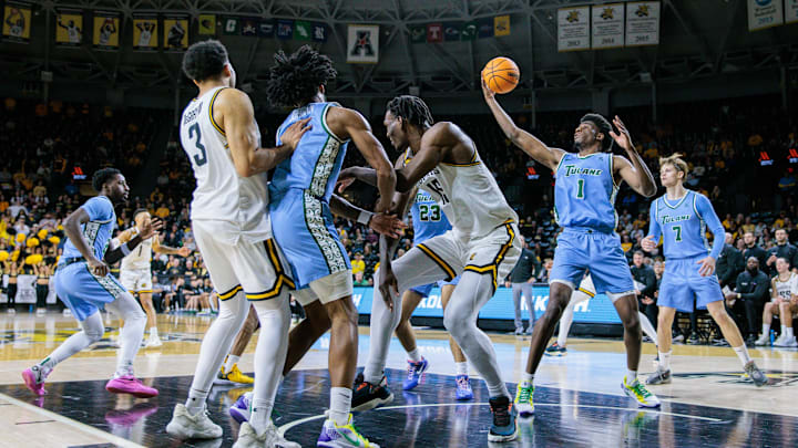 Feb 23, 2025; Wichita, Kansas, USA; Tulane Green Wave forward Kaleb Banks (1) rebounds during the first half against the Wichita State Shockers at Charles Koch Arena.