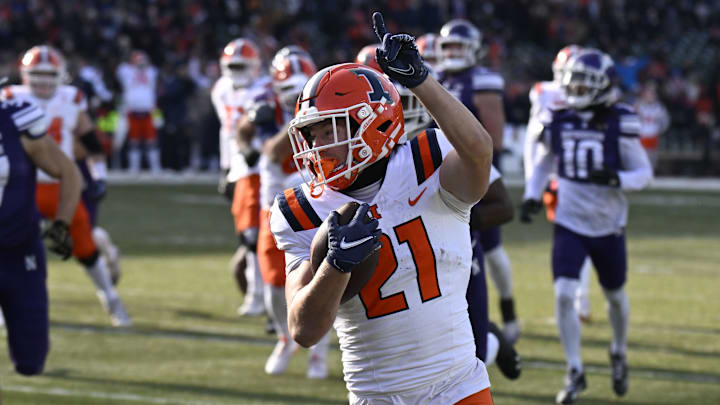 Nov 30, 2024; Chicago, Illinois, USA; Illinois Fighting Illini running back Aidan Laughery (21) runs for a touchdown against Northwestern Wildcats during the first half at Wrigley Field. Mandatory Credit: Matt Marton-Imagn Images Nov 30, 2024; Chicago, Illinois, USA; Illinois Fighting Illini running back Aidan Laughery (21) runs for a touchdown against Northwestern Wildcats during the first half at Wrigley Field. Mandatory Credit: Matt Marton-Imagn Images